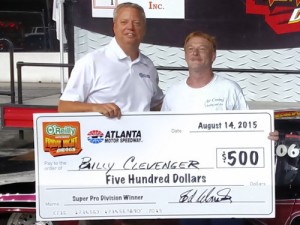 Billy Clevenger (right) accepts the $500 paycheck from Atlanta Motor Speedway's Ed Clark (left) for winning Friday night's Super Pro Shootout during last week's Friday Night Drags.  Photo courtesy Atlanta Motor Speedway