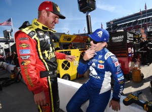 Clint Bowyer (left) talks to Jeff Gordon (right) on the grid during qualifying for Saturday night's NASCAR Sprint Cup Series race at Bristol Motor Speedway.  Photo by Rainier Ehrhardt/NASCAR via Getty Images