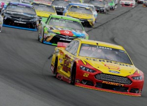 Joey Logano leads a pack of cars during Sunday's NASCAR Sprint Cup Series race at Pocono Raceway.  Photo by Jared C. Tilton/Getty Images