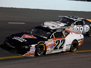 Scott Steckly (22) passes Marc-Antoine Camirand (99) en route to the victory in Saturday's NASCAR Canadian Tire Series ract at Riverside International Speedway.  Photo by Matthew Manor/Getty Images for NASCAR