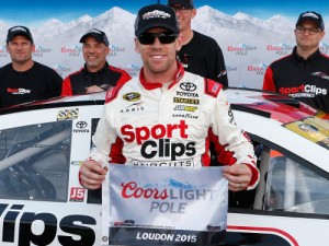 Carl Edwards poses with the Coors Light Pole Award after qualifying for pole position for Sunday's NASCAR Sprint Cup Series race at New Hampshire Motor Speedway.  Photo by Brian Lawdermilk/NASCAR via Getty Images