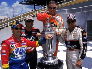 In this photo from 1999, former Brickyard 400 winners (pictured left to right) Jeff Gordon, Dale Jarrett, Ricky Rudd and Dale Earnhardt, Sr. pose with the event trophy. Gordon will surpass Rudd on the all time NASCAR Sprint Cup Series consecutive starts list this weekend at New Hampshire Motor Speedway. Photo by Getty Images