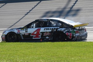 Kevin Harvick sits in the grass after an incident on the track during Sunday's NASCAR Sprint Cup Series race at Chicagoland Speedway. Photo by Josh Hedges/Getty Images
