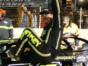 Chris Madden waves to the crowd after scoring the $10,000 Gobbler 77 victory Saturday night at Cleveland Speedway.  Photo by Ronnie Barnett/The Photo Man