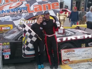 Lee Pulliam celebrates in victory lane with his wife, LeAnne, after winning Sunday's Late Model Stock feature at Southern National Motorsports Park.  Photo courtesy SNMP Media