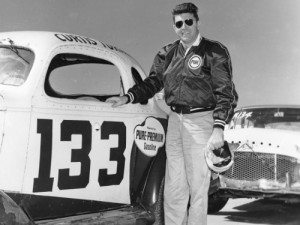Curtis Turner poses with the car he drove to a second-place finish in the NASCAR Modified-Sportsman race on the Daytona Beach-Road Course  On Friday, he will be inducted into the NASCAR Hall of Fame.  Photo: ISC Archives via Getty Images