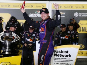 Denny Hamlin celebrates in victory lane after winning last year's Advance Auto Parts Clash at Daytona International Speedway.  Photo by Patrick Smith/Getty Images