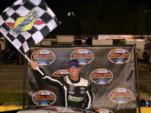 Burt Myers celebrates his second NASCAR Whelen Southern Modified Tour win of the season after taking the checkered flag at Caraway Speedway. Photo by Grant Halverson/NASCAR