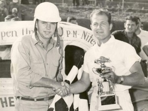 Charlie Mincey (left) and flagman Neal Roberts shake hands in victoyr lane after a win by Mincey at Gainesville, Georgia's Looper Speedway in 1954. Photo: Courtesy Mike Bell