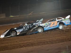 Cory Hedgecock (23) works to the inside of Scott Dedwylder (33) with two laps to go in Saturday night's NeSmith Chevrolet Dirt Late Model Series race at I-75 Raceway.  Photo by Bruce Carroll/NeSmith Media