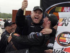 Austin Cindric and his crew chief Chris Carrier celebrate their NASCAR K&N Pro Series East win in victory lane at Virginia International Raceway. Photo by Bob Leverone