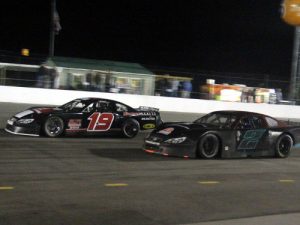 Chris Burns (19) battles with Joshual Yeoman (2) for the lead in Saturday's Late Model feature at Carteret County Speedway.  Photo: Carteret County Speedway Media