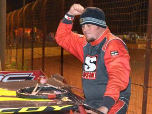 David McCoy celebrates as he climbs from his car after scoring a victory Friday night at Lavonia Speedway. Photo: DTGW Productions / CW Photography