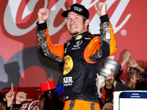 Martin Truex, Jr. celebrates in victory lane after winning Sunday's NASCAR Sprint Cup Series Coca-Cola 600 at Charlotte Motor Speedway.  Photo by Todd Warshaw/NASCAR via Getty Images