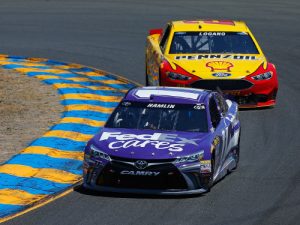 Joey Logano (22) chases Denny Hamlin (11) during Sunday's NASCAR Sprint Cup Series race at Sonoma Raceway.  Photo by Jonathan Ferrey/Getty Images