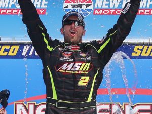 Doug Coby celebrates in victory lane after winning Saturday's NASCAR Whelen Modified Tour race at New Hampshire Motor Speedway.  Photo by Sarah Crabill/NASCAR via Getty Images
