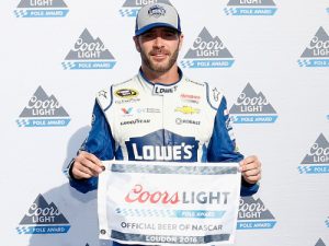 Jimmie Johnson poses with the Coors Light Pole Award after qualifying on the pole for Sunday's NASCAR Sprint Cup Series race at New Hampshire Motor Speedway.  Photo by Todd Warshaw/NASCAR via Getty Images