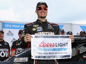 Martin Truex, Jr. poses with the Coors Light Pole Award after qualifying on the pole position for Sunday's NASCAR Sprint Cup Series race at Pocono Raceway.  Photo by Adam Glanzman/Getty Images