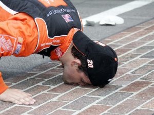 Tony Stewart kisses the bricks after one of his two wins in the NASCAR Sprint Cup Series Brickyard 400 at Indianapolis Motor Speedway.  He looks to add a third win to his tally in his final appearance at the speedway on Sunday.  Photo: ISC Archives via Getty Images