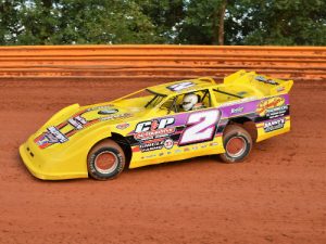 Colby Cannon powers through turns three and four at Toccoa Raceway.  Cannon scored Saturday night's FASTRAK Pro Late Model feature at the speedway.  Photo: DTGW Productions / CW Photography