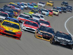 Drivers battle for position during the June NASCAR Sprint Cup Series race at Michigan International Speedway.  Photo by Drew Hallowell/Getty Images