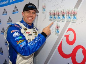 Carl Edwards poses with the Coors Light Pole board after qualifying for the pole position for Sunday's NASCAR Sprint Cup Series race at New Hampshire Motor Speedway.  Photo by Chris Trotman/NASCAR via Getty Images