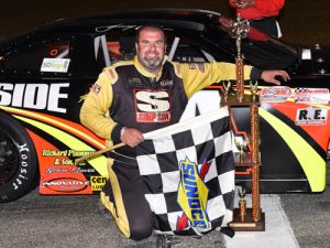 Johnny Clark smiles in victory lane after scoring Saturday night's PASS North Super Late Model feature victory at White Mountain Motorsports Park.  Photo by Norm Marx