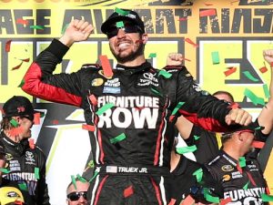 Martin Truex, Jr. celebrates in victory lane after winning Sunday's NASCAR Sprint Cup Series race at Chicagoland Speedway.  Photo by Kena Krutsinger/Getty Images