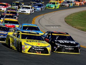 Matt Kenseth (20) and Martin Truex, Jr. (78) lead the field to the line for a restart during Sunday's NASCAR Sprint Cup Series race at New Hampshire Motor Speedway.  Photo by Jerry Markland/Getty Images