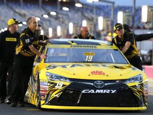 The car of Carl Edwards is pushed onto the grid during Friday's qualifying for Saturday night's NASCAR Sprint Cup Series race at Charlotte Motor Speedway.  Photo by Jerry Markland/Getty Images