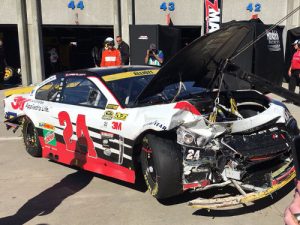 Chase Elliott's heavily damaged Chevrolet is towed back to the garage after a lap 256 accident eliminated him from Sunday's race at Charlotte. Elliott had led 103 laps on the day. Photo by Pete McCole