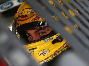 Joey Logano sits in his car during practice for Saturday night's NASCAR Sprint Cup Series race at Charlotte Motor Speedway.  Photo by Sarah Crabill/Getty Images