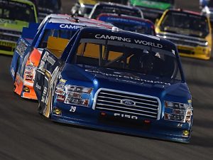 Tyler Reddick (29) leads teammate Daniel Hemric (19) during Saturday night's NASCAR Camping World Truck Series race at Las Vegas Motor Speedway.  Photo by Jonathan Moore/NASCAR via Getty Images