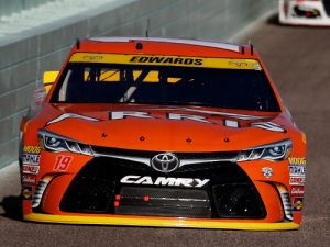 Carl Edwards leads a pack of cars during Sunday night's NASCAR Sprint Cup Series race at Homestead-Miami Speedway.  Photo by Chris Trotman/Getty Images