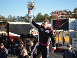 Deac McCaskill raises the CARS Racing Tour Late Model Stock championship trophy after claiming his first series title at Southern National Motorsports Park on Saturday. Photo by Kyle Tretow/CARS Tour