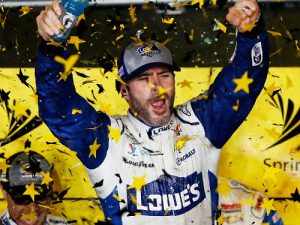 Jimmie Johnson celebrates after winning the NASCAR Sprint Cup Series season finale and the 2016 NASCAR Sprint Cup Series Championship at Homestead-Miami Speedway.  Johnson's title victory gave him a record-tying 7th NASCAR title.  Photo by Chris Trotman/Getty Images
