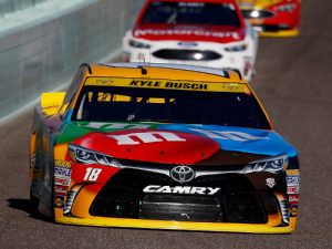 Kyle Busch leads a pack of cars during Sunday night's NASCAR Sprint Cup Series race at Homestead-Miami Speedway. Photo by Chris Trotman/Getty Images