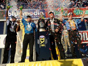 NHRA Mello Drag Racing 2016 champions Antron Brown (Top Fuel), Ron Capps (Funny Car), Jason Line (Pro Stock) and Jerry Savoie (Pro Stock Motorcycle) celebrate after Sunday's NHRA Finals at Pomona, California.  Photo:  NHRA Media