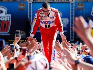 Tony Stewart greets fans as he is introduced prior to Sunday night's NASCAR Sprint Cup Series race at Homestead-Miami Speedway. Photo by Chris Trotman/Getty Images